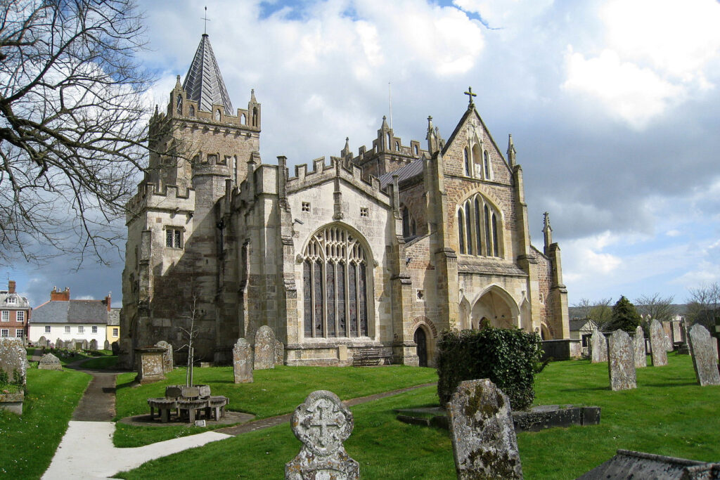 The church of St Mary in Ottery St Mary against a blue sky